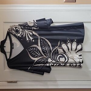 Black, tan, and white floral Tunis with ruffled sleeves